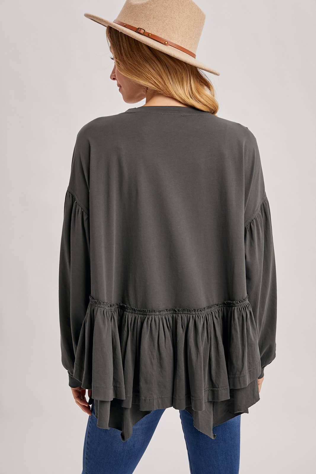 RUFFLED PEPLUM HEM OVERSIZED KNIT TOP