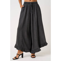 WASHED CHAMBRAY RUFFLE HEM WIDE LEG PANTS