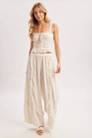 BOHO EYELET LACE RUFFLE TRIMMED WIDE PANTS